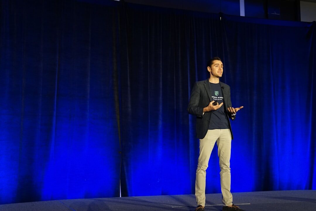person giving speech on stage