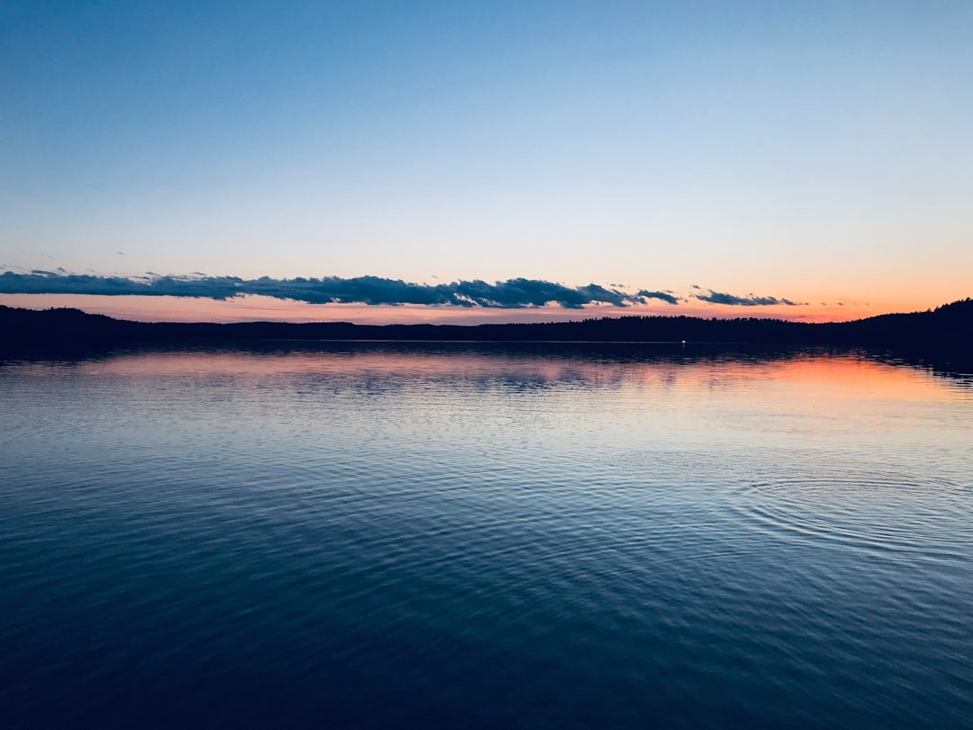 sunrise over calm lake